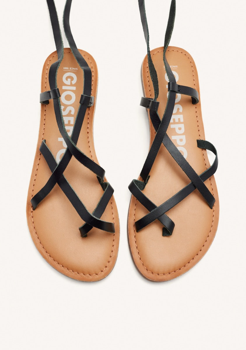 Lussat sandals with thin black straps to tie around the leg